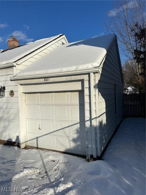 view of snow covered garage