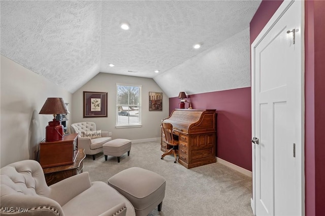 carpeted home office featuring lofted ceiling and a textured ceiling