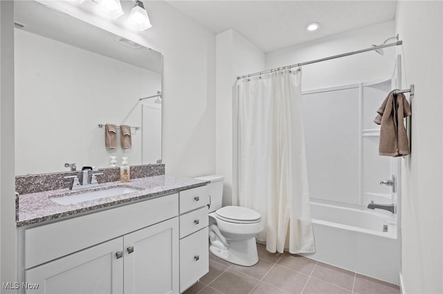 full bathroom featuring vanity, shower / bath combination with curtain, tile patterned floors, and toilet