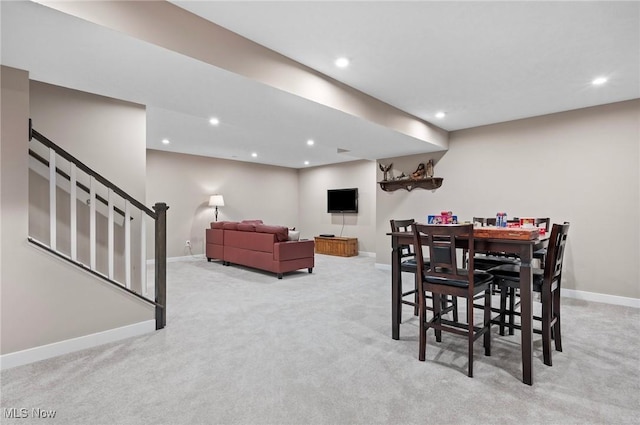 dining space with light carpet