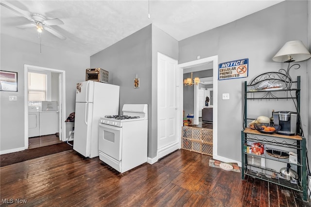 kitchen with dark hardwood / wood-style flooring, white appliances, washing machine and clothes dryer, and ceiling fan