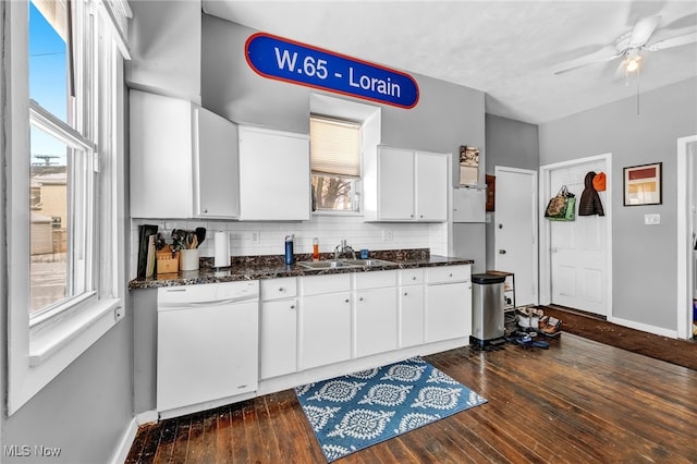 kitchen featuring dark hardwood / wood-style floors, white cabinetry, dishwasher, sink, and decorative backsplash