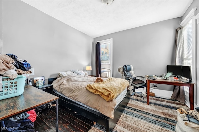 bedroom with lofted ceiling