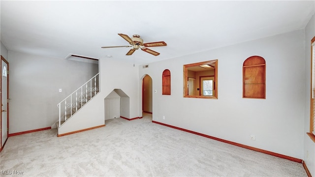 living room with light carpet and ceiling fan