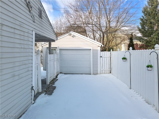 view of snow covered garage