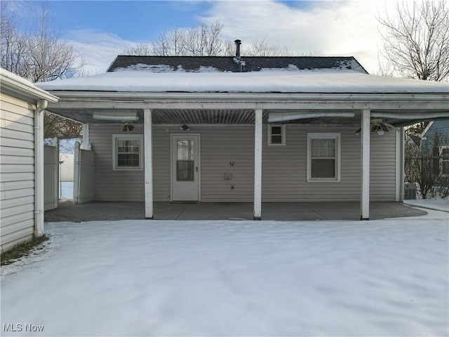 view of snow covered property