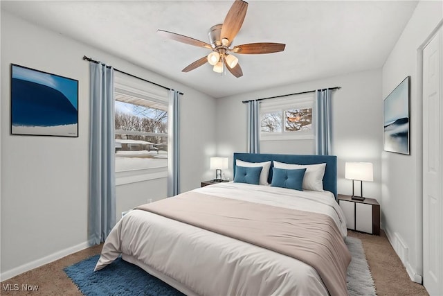 bedroom featuring ceiling fan and light colored carpet