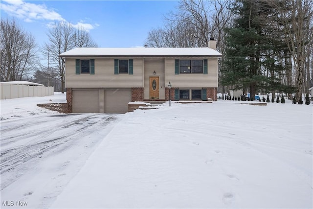 raised ranch featuring a garage