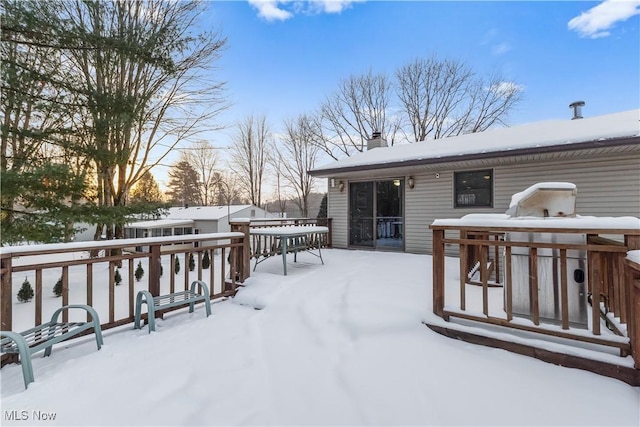 view of snow covered deck