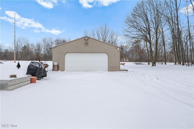 view of snow covered garage