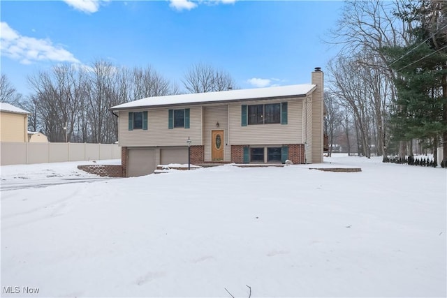 split foyer home featuring a garage