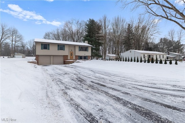 raised ranch featuring a garage