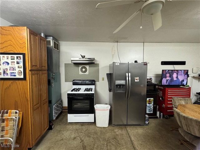 kitchen with refrigerator, stainless steel fridge, ceiling fan, gas stove, and a textured ceiling