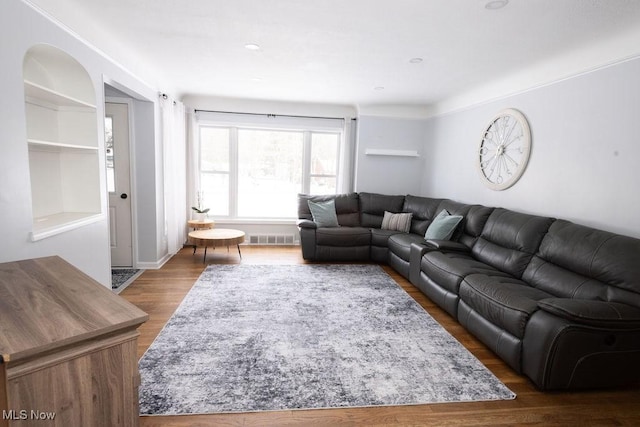 living room with dark hardwood / wood-style floors