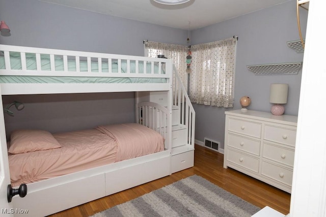 bedroom with hardwood / wood-style flooring