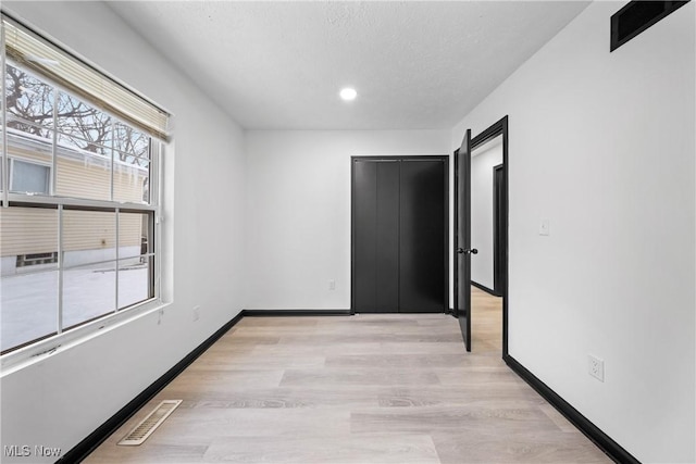 empty room featuring light hardwood / wood-style flooring