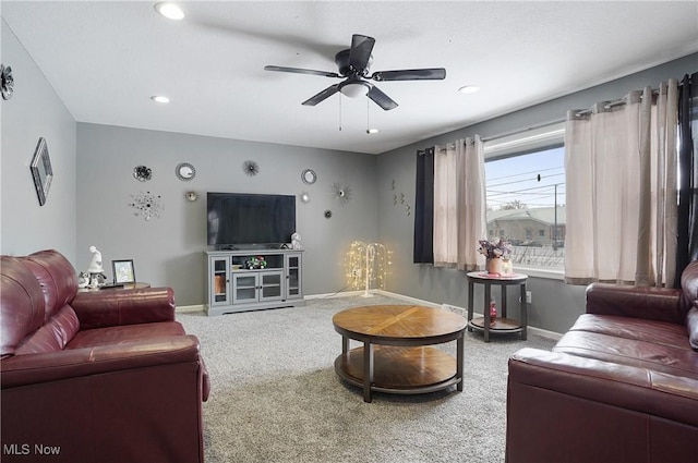 living room with carpet floors and ceiling fan