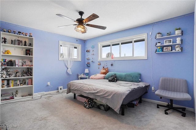 carpeted bedroom with ceiling fan