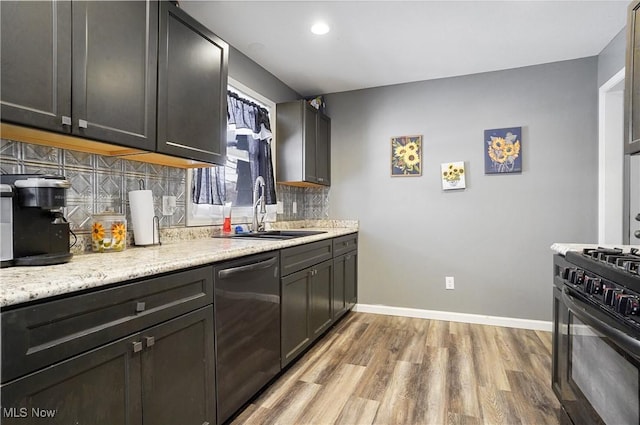 kitchen with sink, light hardwood / wood-style flooring, dishwasher, black range with gas cooktop, and decorative backsplash