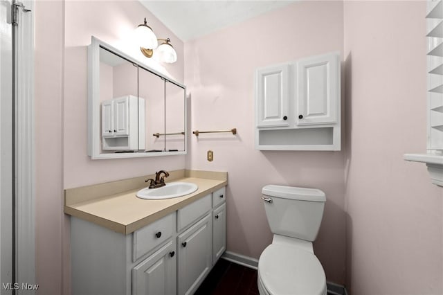 bathroom with vanity and toilet