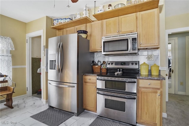 kitchen with tasteful backsplash, appliances with stainless steel finishes, and light brown cabinets