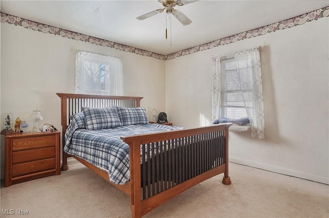 bedroom with light colored carpet and ceiling fan