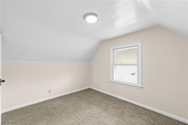 bonus room featuring lofted ceiling and carpet floors