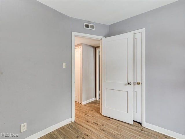 empty room with light wood-type flooring