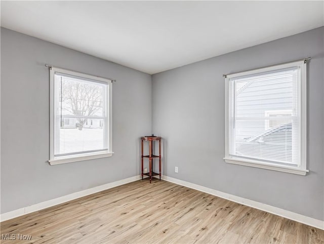 empty room with light wood-type flooring