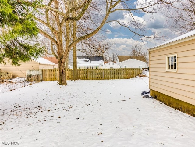 view of yard covered in snow