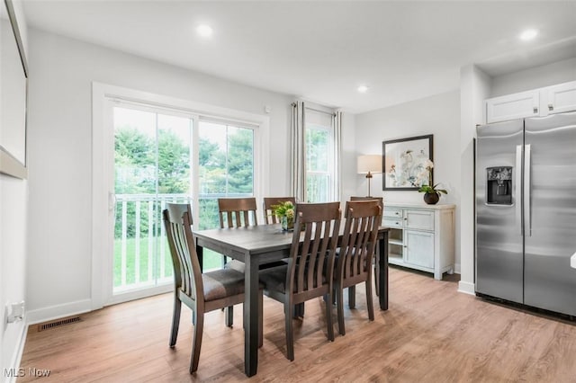 dining space featuring light wood-type flooring