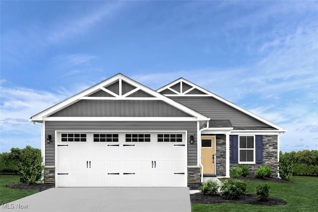 craftsman-style house with a garage and a front lawn