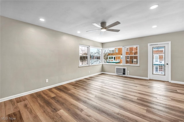 unfurnished room featuring ceiling fan and wood-type flooring