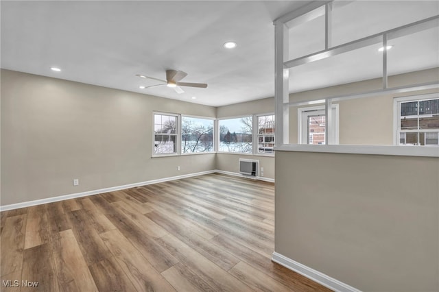 spare room featuring ceiling fan and hardwood / wood-style floors