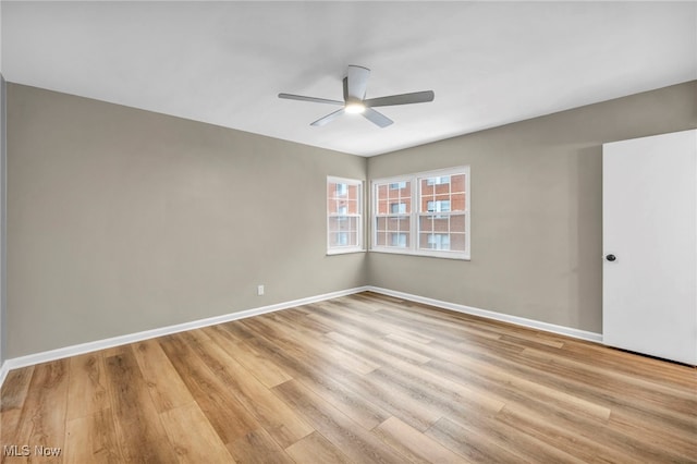 unfurnished room with ceiling fan and light hardwood / wood-style floors