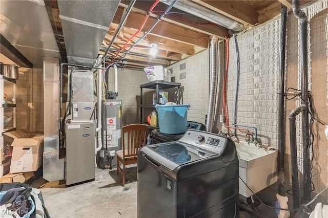 utilities with heating unit, sink, washer / dryer, and water heater