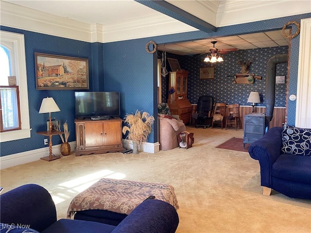 carpeted living room featuring ornamental molding and a wood stove