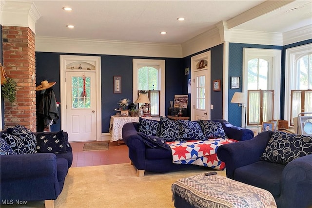 living room with ornamental molding and tile patterned floors