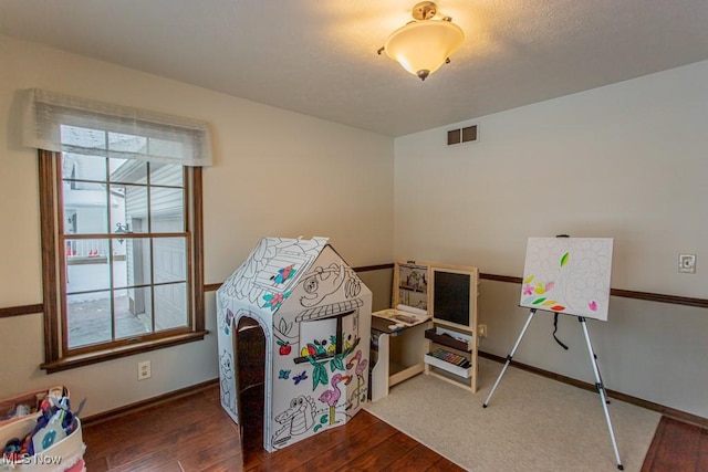 playroom featuring hardwood / wood-style flooring