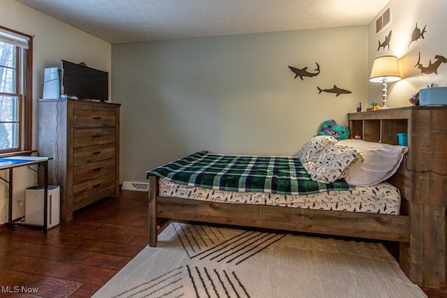 bedroom featuring dark hardwood / wood-style floors