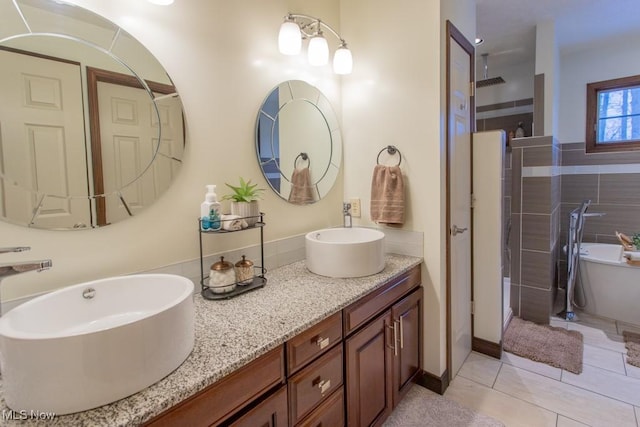 bathroom with vanity, tile patterned flooring, and shower with separate bathtub