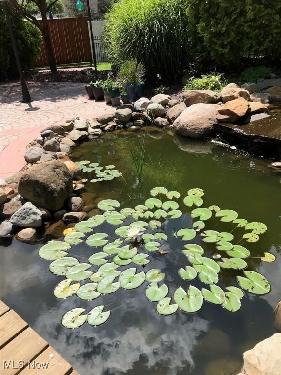 exterior space featuring a small pond