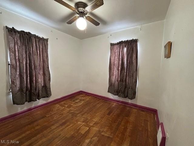 unfurnished room featuring hardwood / wood-style flooring and ceiling fan