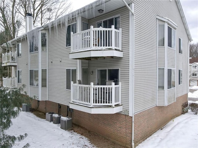 snow covered building featuring central AC