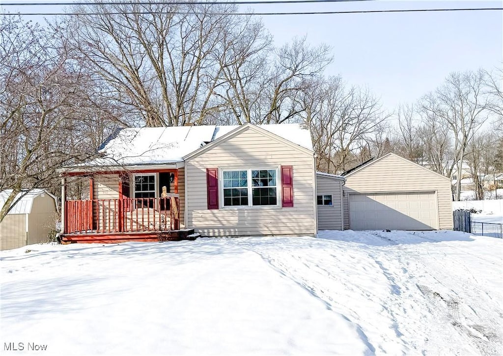 view of front of property with a garage and a porch