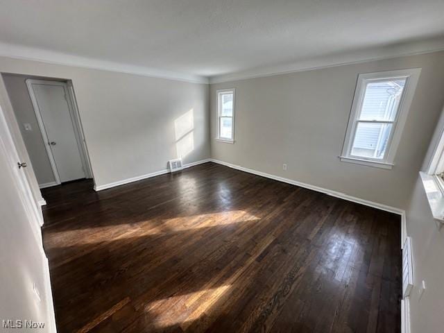 5111 Lucydale Ave, North Olmsted, OH 44070 - empty room with dark wood finished floors, baseboards, and ornamental molding