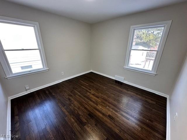 5111 Lucydale Ave, North Olmsted, OH 44070 - spare room featuring dark wood-style floors and baseboards
