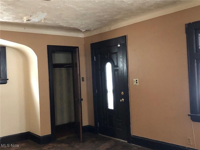 foyer featuring a textured ceiling