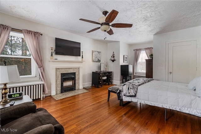 1011 Genesee Dr, Youngstown, OH 44511 - bedroom with multiple windows, wood-type flooring, radiator, and ceiling fan