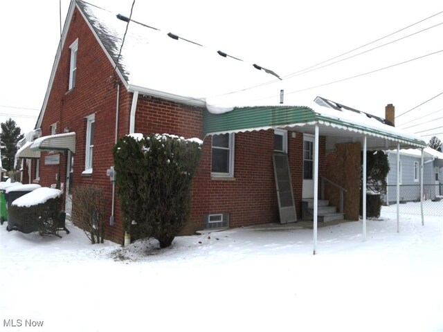 view of snow covered property